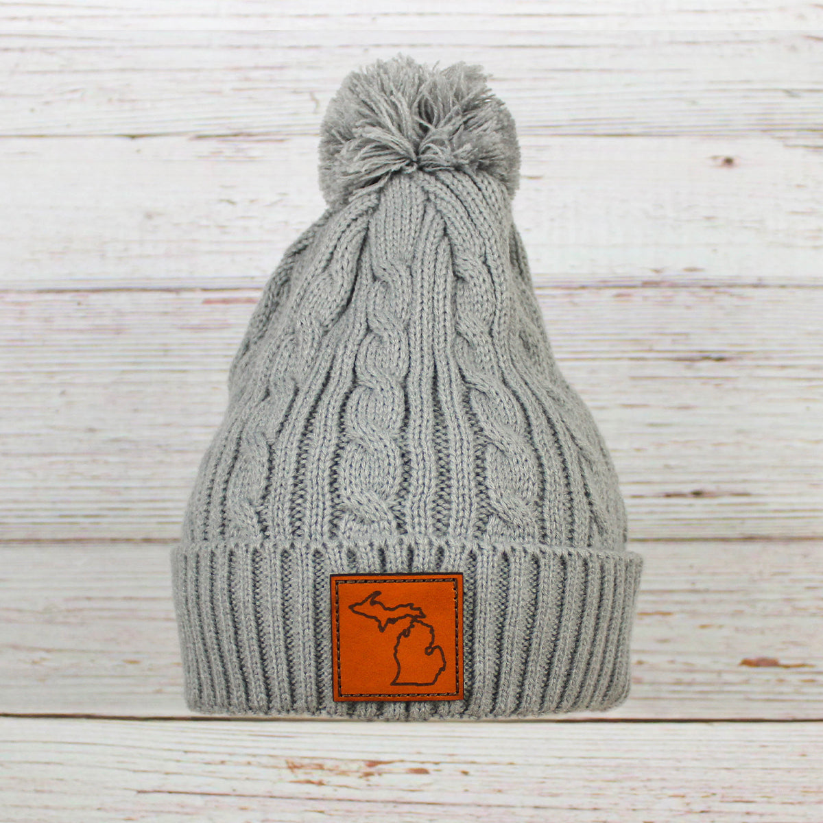 Leather Patch Cable Knit Pom Beanie
